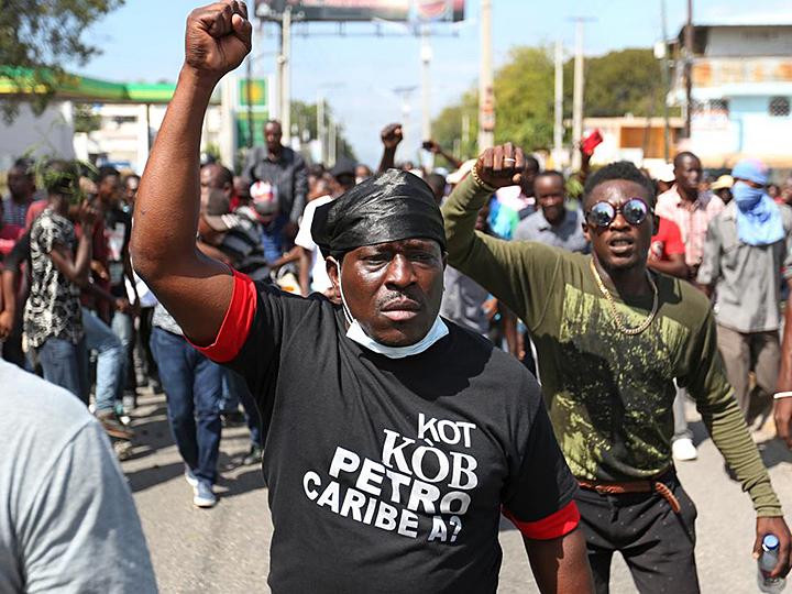 Protesters take part in anti-government demonstrations in Port-au-Prince
