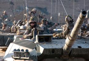 Tank crews in Afghanistan wait for the order to move out