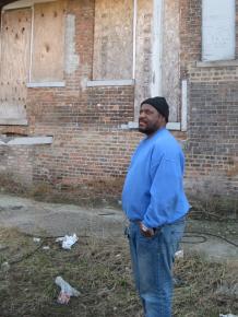 Marvin Reeves stands outside the apartment building where Chicago police snatched him in the middle of the night 21 years ago