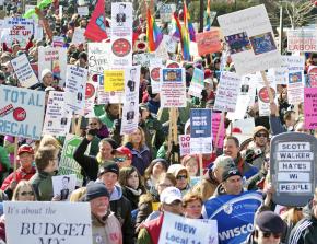 Workers and supporters from across the Midwest marched in Madison after Walker signed the union-busting law