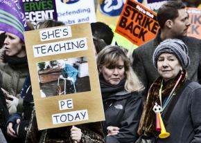 Public-sector workers march in London during a one-day strike against attacks on their pensions