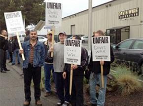 Striking workers picket outside Davis Wire