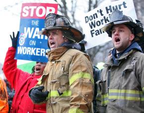 Thousands of people protested inside and outside Michigan's Capitol building as lawmakers passed "right-to-work" legislation