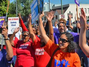 Striking BART workers are joined by supporters for a picket line rally