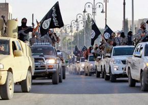 ISIS fighters riding in a convoy