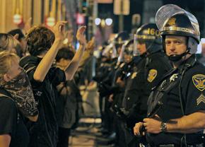 Police confront protesters in the Mission