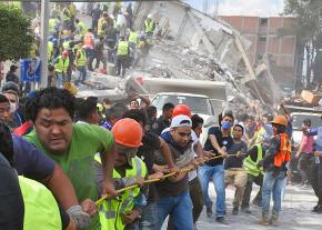 Volunteers help clear the rubble after the Mexico City earthquake