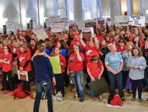 Striking teachers mass inside the West Virginia State Capitol building