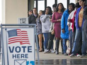 Voters line up outside a polling place on Election Day